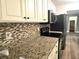 Kitchen with granite countertops and stylish backsplash at 143 44Th N Ave, St Petersburg, FL 33703