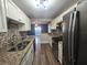 Updated kitchen with granite countertops and stainless steel appliances at 143 44Th N Ave, St Petersburg, FL 33703