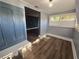 Bright sunroom features wood-look floors and white shutters at 143 44Th N Ave, St Petersburg, FL 33703