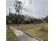 Large lot with mature trees and a spacious front yard at 1505 E Park Cir, Tampa, FL 33610