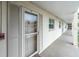 Exterior view of building showing walkway and condo entrance at 19029 Us Highway 19 N # 5-1, Clearwater, FL 33764