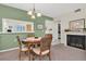 Dining area with round table and chairs near fireplace at 19029 Us Highway 19 N # 5-1, Clearwater, FL 33764