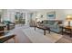 Bright living room featuring comfortable seating and view to patio at 19029 Us Highway 19 N # 5-1, Clearwater, FL 33764