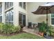 Small patio with table and chairs for relaxing outdoors at 19029 Us Highway 19 N # 5-1, Clearwater, FL 33764
