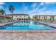 Inviting community pool with plenty of lounge chairs at 19029 Us Highway 19 N # 5-1, Clearwater, FL 33764