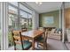 Relaxing sunroom with seating and a table for dining at 19029 Us Highway 19 N # 5-1, Clearwater, FL 33764