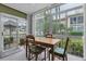 Sunroom with table and chairs, providing extra living space at 19029 Us Highway 19 N # 5-1, Clearwater, FL 33764