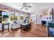 Living room with hardwood floors, fireplace, and large windows at 1918 Virginia Dr, Bradenton, FL 34205