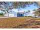 Charming light blue house with stone accents and a two-car garage at 2405 Lema Dr, Spring Hill, FL 34609