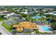 Community clubhouse, pool, and tennis courts at 2460 Canadian Way # 6, Clearwater, FL 33763