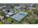 Aerial view of community tennis courts and surrounding landscape at 2460 Canadian Way # 6, Clearwater, FL 33763