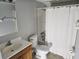 Clean bathroom, featuring a shower/tub combo and wood vanity at 2850 Somerset Park Dr # 102, Tampa, FL 33613