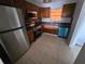 Kitchen with stainless steel appliances and wood cabinets at 2850 Somerset Park Dr # 102, Tampa, FL 33613