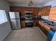 Kitchen with stainless steel appliances and wood cabinets at 2850 Somerset Park Dr # 102, Tampa, FL 33613