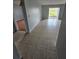 Living room with tile floors and access to another room at 2850 Somerset Park Dr # 102, Tampa, FL 33613