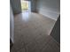 Spacious living room featuring tile flooring and sliding glass doors at 2850 Somerset Park Dr # 102, Tampa, FL 33613
