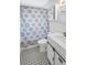 Clean bathroom with white vanity and patterned shower curtain at 4567 26Th N Ave, St Petersburg, FL 33713