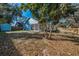 This view of the large, fenced backyard showcases the outdoor space and shed at 5524 Kentucky Ave, New Port Richey, FL 34652