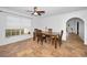 Dining area with tile floors, ceiling fan, and natural light from the window at 5524 Kentucky Ave, New Port Richey, FL 34652