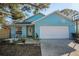 Charming blue single-Gathering home with a well-maintained lawn and a one-car garage at 5524 Kentucky Ave, New Port Richey, FL 34652