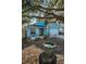 Charming blue single-Gathering home with a well-maintained lawn, swing and a one-car garage at 5524 Kentucky Ave, New Port Richey, FL 34652