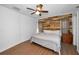 Main bedroom featuring modern wood accent wall and wood laminate flooring at 5524 Kentucky Ave, New Port Richey, FL 34652