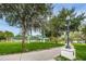 Public park featuring walking path, mature trees, and covered pavillions in the distance at 5524 Kentucky Ave, New Port Richey, FL 34652