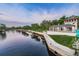 Scenic waterfront view with a building featuring a tower and accessible pier at 5524 Kentucky Ave, New Port Richey, FL 34652