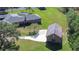 Aerial view showing home, detached garage, and pool at 8345 Shenandoah Run, Wesley Chapel, FL 33544