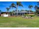 Large backyard with screened patio and lush lawn at 8345 Shenandoah Run, Wesley Chapel, FL 33544