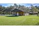 Rustic barn exterior with fenced area at 8345 Shenandoah Run, Wesley Chapel, FL 33544