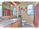 Updated bathroom with granite countertop and tiled floors at 8345 Shenandoah Run, Wesley Chapel, FL 33544