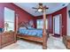 Spacious bedroom with a large wooden bed frame and plenty of natural light at 8345 Shenandoah Run, Wesley Chapel, FL 33544