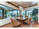 Charming breakfast nook with a rustic wooden table and wicker chairs at 8345 Shenandoah Run, Wesley Chapel, FL 33544