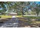 Long driveway leading to a home and detached garage at 8345 Shenandoah Run, Wesley Chapel, FL 33544