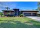 Beautiful two-story home with stone accents and a three-car garage at 8345 Shenandoah Run, Wesley Chapel, FL 33544