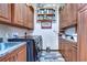 Bright laundry room featuring wooden cabinets and a built-in shelving unit at 8345 Shenandoah Run, Wesley Chapel, FL 33544