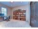Spacious home office with large bookshelf at 8345 Shenandoah Run, Wesley Chapel, FL 33544