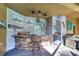 Well-equipped outdoor kitchen with a bar and grill at 8345 Shenandoah Run, Wesley Chapel, FL 33544