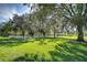 White fenced paddock with large trees at 8345 Shenandoah Run, Wesley Chapel, FL 33544