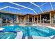 Inviting screened pool and spa with a spacious deck area at 8345 Shenandoah Run, Wesley Chapel, FL 33544