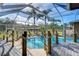 Relaxing screened pool and spa with surrounding deck and hot tub at 8345 Shenandoah Run, Wesley Chapel, FL 33544