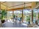 Peaceful screened porch with outdoor seating and pool views at 8345 Shenandoah Run, Wesley Chapel, FL 33544