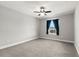 Bright bedroom with ceiling fan and blue curtains at 1003 Starboard Ct, Oldsmar, FL 34677