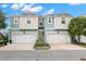Two-story townhome with two-car garage and neutral color at 1003 Starboard Ct, Oldsmar, FL 34677