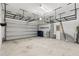 Garage with overhead storage racks and ample space for parking at 1003 Starboard Ct, Oldsmar, FL 34677