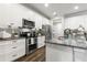 Spacious kitchen featuring white cabinets and stainless steel appliances at 1003 Starboard Ct, Oldsmar, FL 34677