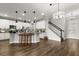 Open concept kitchen and dining area with an island and hardwood floors at 1003 Starboard Ct, Oldsmar, FL 34677