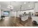 Bright living room with hardwood floors and access to a balcony with water view at 1003 Starboard Ct, Oldsmar, FL 34677