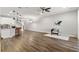 Open living space with hardwood floors and access to a patio at 1003 Starboard Ct, Oldsmar, FL 34677